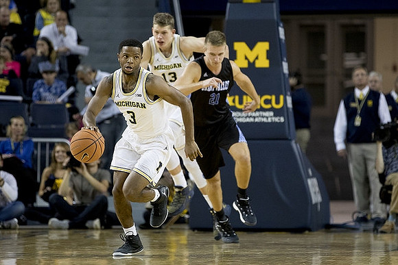 Zavier Simpson (3) and Moritz Wagner (13)