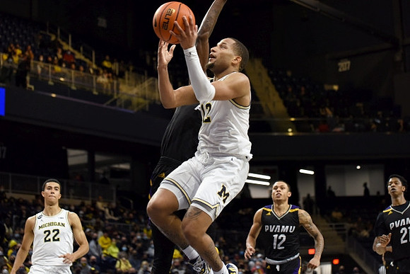 Caleb Houstan (22) and DeVante' Jones (12)