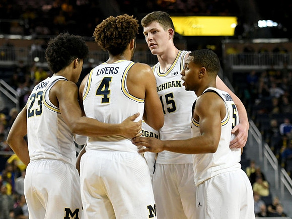 Ibi Watson (23), Isaiah Livers (4), Jon Teske (15), and Jaaron Simmons (5)