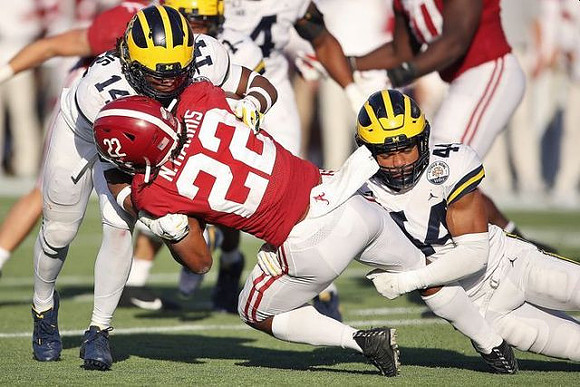 Josh Metellus (14) and Cameron McGrone (44)