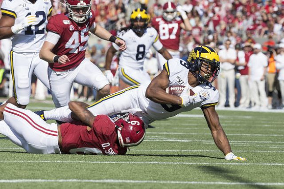 Josh Ross (12), Devin Gil (8), and Donovan Peoples-Jones (9)