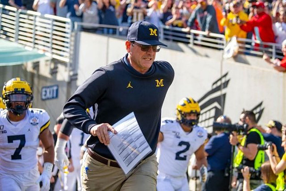 Khaleke Hudson (7), Jim Harbaugh, and Carlo Kemp (2)