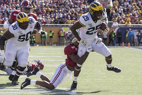 Michael Onwenu (50) and Hassan Haskins (25)