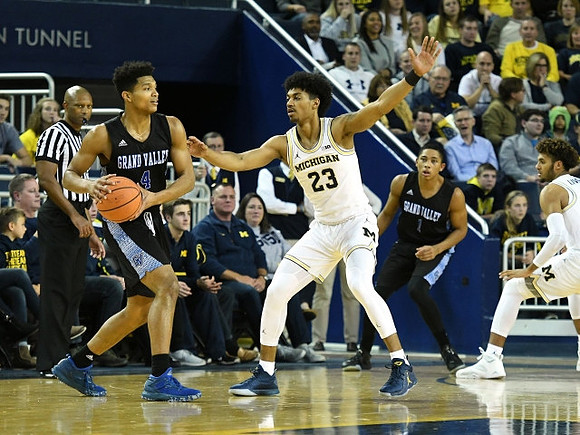Ibi Watson (23) and Isaiah Livers (4)