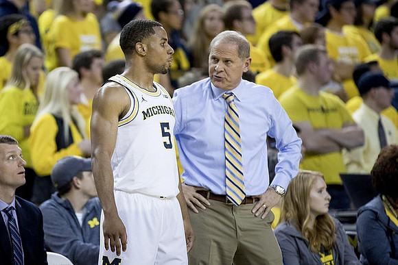 Jaaron Simmons (5) and John Beilein