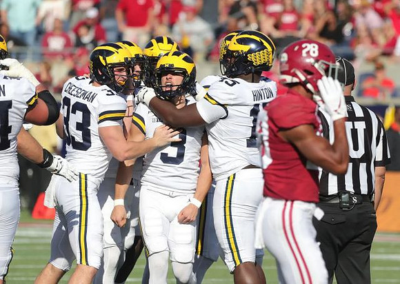 Camaron Cheeseman (33), Quinn Nordin (3), and Christopher Hinton (15)