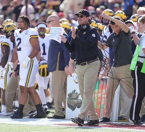 Carlo Kemp (2) and Jim Harbaugh