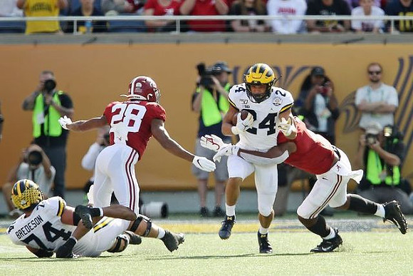 Ben Bredeson (74) and Zach Charbonnet (24)