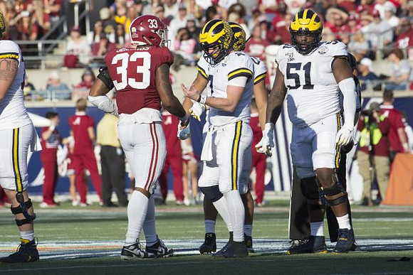Shea Patterson (2) and Cesar Ruiz (51)