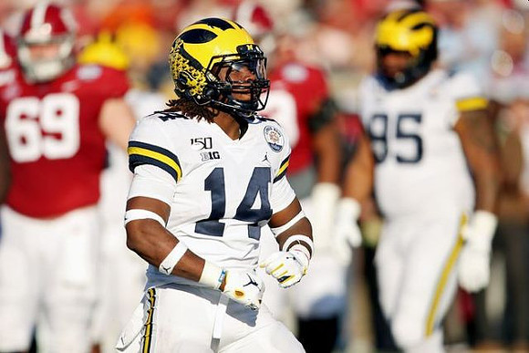 Josh Metellus (14) and Donovan Jeter (95)