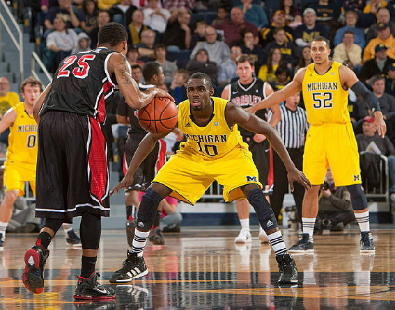 Zack Novak (0), Tim Hardaway Jr. (10), and Jordan Morgan (52)