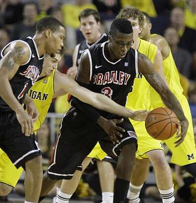 Stu Douglass (1), Evan Smotrycz (23), and Jordan Morgan (52)