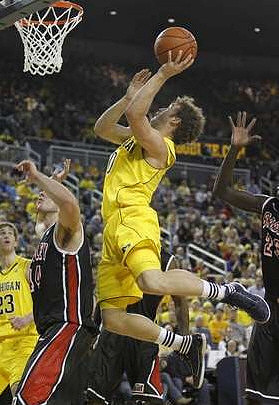 Evan Smotrycz (23) and Zack Novak (0)