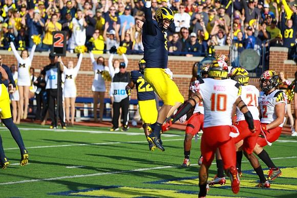 Karan Higdon (22) and Wilton Speight (3)