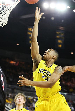 Evan Smotrycz (23) and Trey Burke (3)
