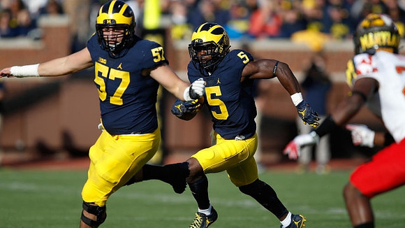 Patrick Kugler (57) and Jabrill Peppers (5)