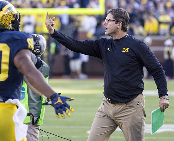 Khalid Hill (80) and Jim Harbaugh