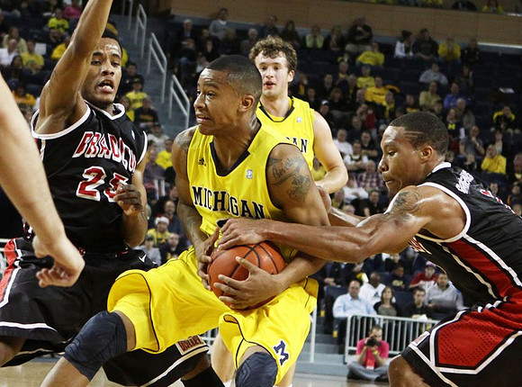 Trey Burke (3) and Zack Novak (0)