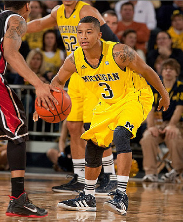 Trey Burke (3) and Jordan Morgan (52)