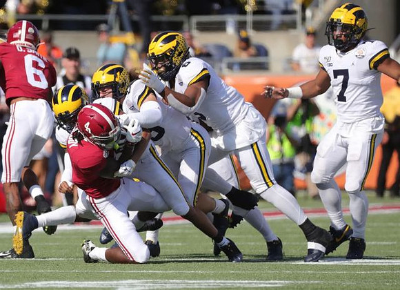 Jordan Glasgow (29), Josh Uche (6), and Khaleke Hudson (7)