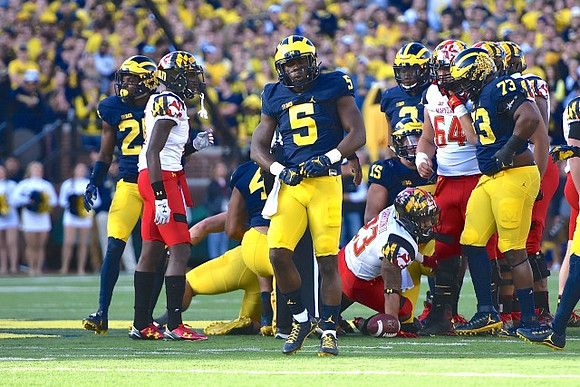 Jabrill Peppers (5) and Maurice Hurst (73)