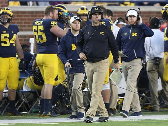 Carl Myers (54), Garrett Miller (55), Jim Harbaugh, and Jay Harbaugh