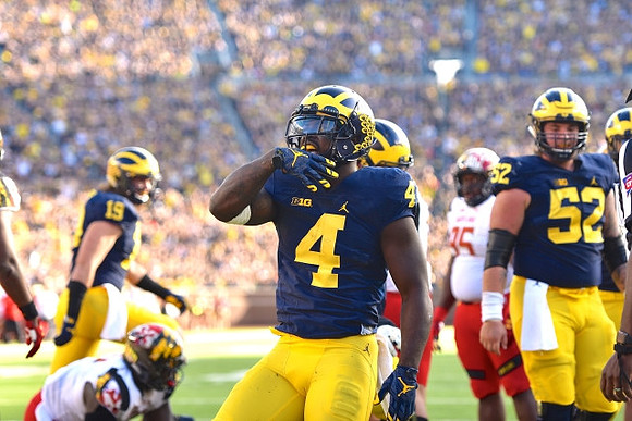 Henry Poggi (19), De'Veon Smith (4), and Mason Cole (52)