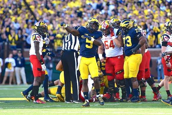 Jabrill Peppers (5) and Maurice Hurst (73)