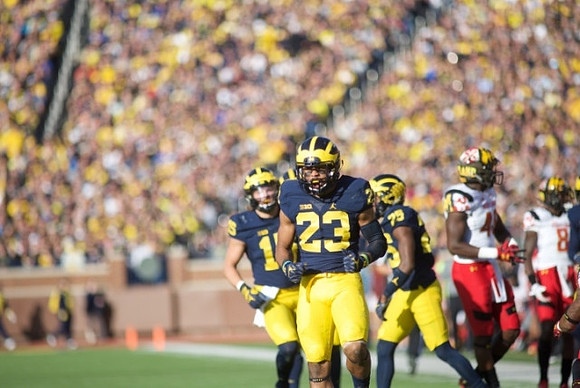 Chase Winovich (15) and Tyree Kinnel (23)