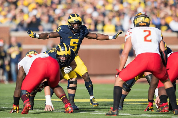 Mason Cole (52) and Jabrill Peppers (5)
