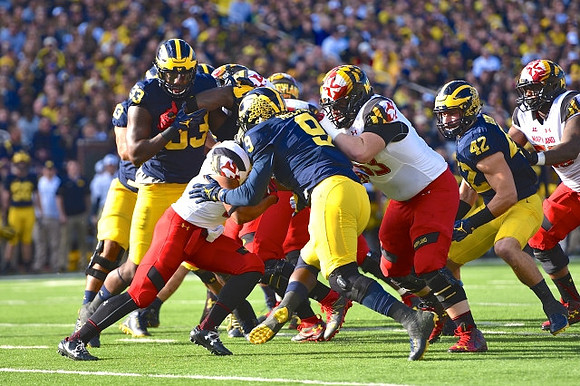 Taco Charlton (33), Mike McCray (9), and Ben Gedeon (42)