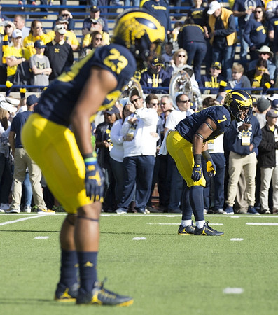 Tyree Kinnel (23) and Khaleke Hudson (7)