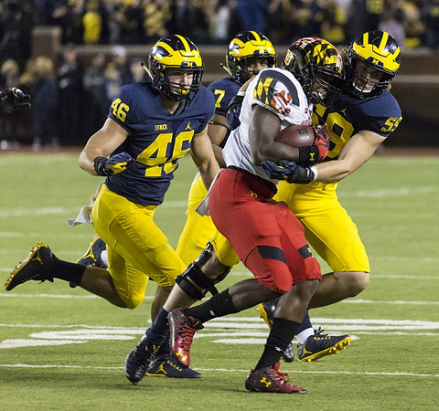 Michael Wroblewski (46), Khaleke Hudson (7), and Noah Furbush (59)