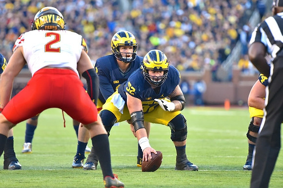 Wilton Speight (3) and Mason Cole (52)