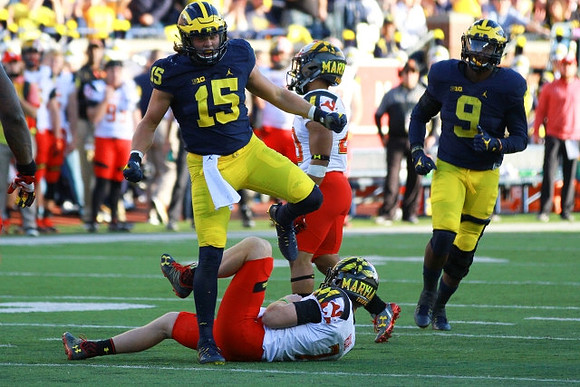 Chase Winovich (15) and Mike McCray (9)