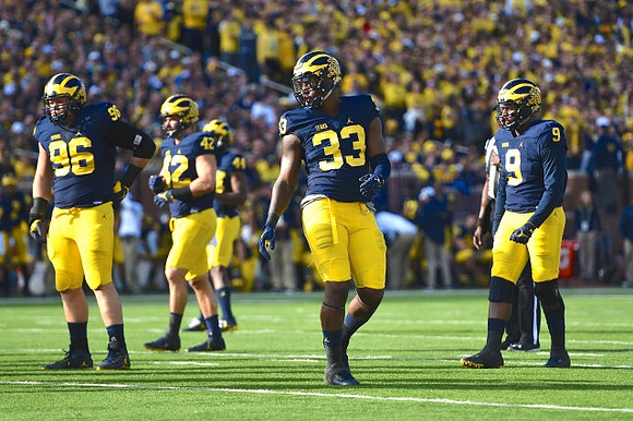 Ryan Glasgow (96), Ben Gedeon (42), Delano Hill (44), Taco Charlton (33), and Mike McCray (9)
