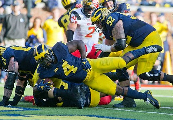 Kyle Kalis (67), De'Veon Smith (4), and Mason Cole (52)