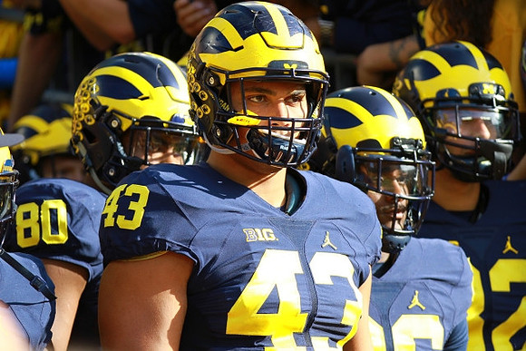 Khalid Hill (80) and Chris Wormley (43)