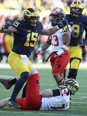 Chase Winovich (15) and Channing Stribling (8)