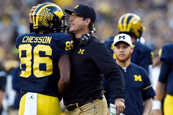 Jehu Chesson (86) and Jim Harbaugh