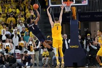 Hunter Dickinson (1) and Terrance Williams II (5)