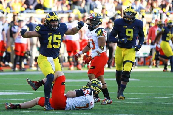 Chase Winovich (15) and Mike McCray (9)