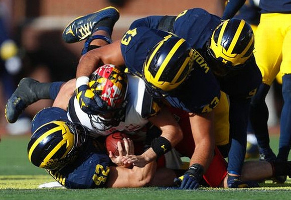 Ben Gedeon (42), Chris Wormley (43), and Mike McCray (9)