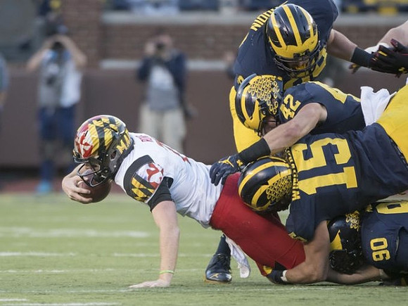Matthew Godin (99), Ben Gedeon (42), Chase Winovich (15), and Bryan Mone (90)