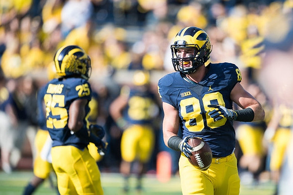 Dymonte Thomas (25) and Jake Butt (88)