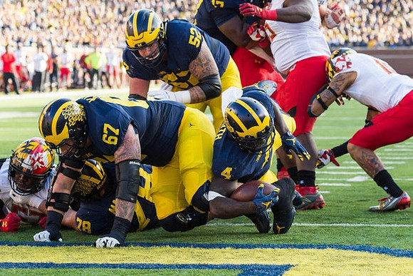 Erik Magnuson (78), Kyle Kalis (67), Mason Cole (52), and De'Veon Smith (4)