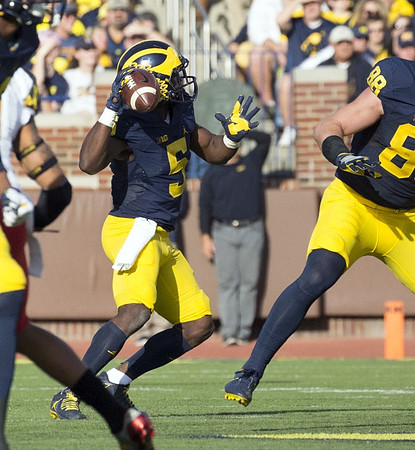 Jabrill Peppers (5) and Jake Butt (88)