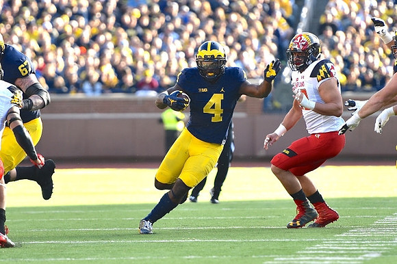 Kyle Kalis (67) and De'Veon Smith (4)