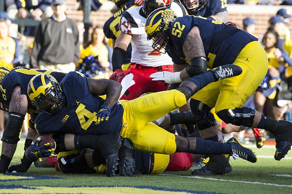 Kyle Kalis (67), De'Veon Smith (4), and Mason Cole (52)