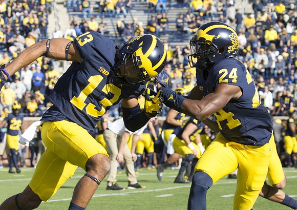 Eddie McDoom (13) and Lavert Hill (24)